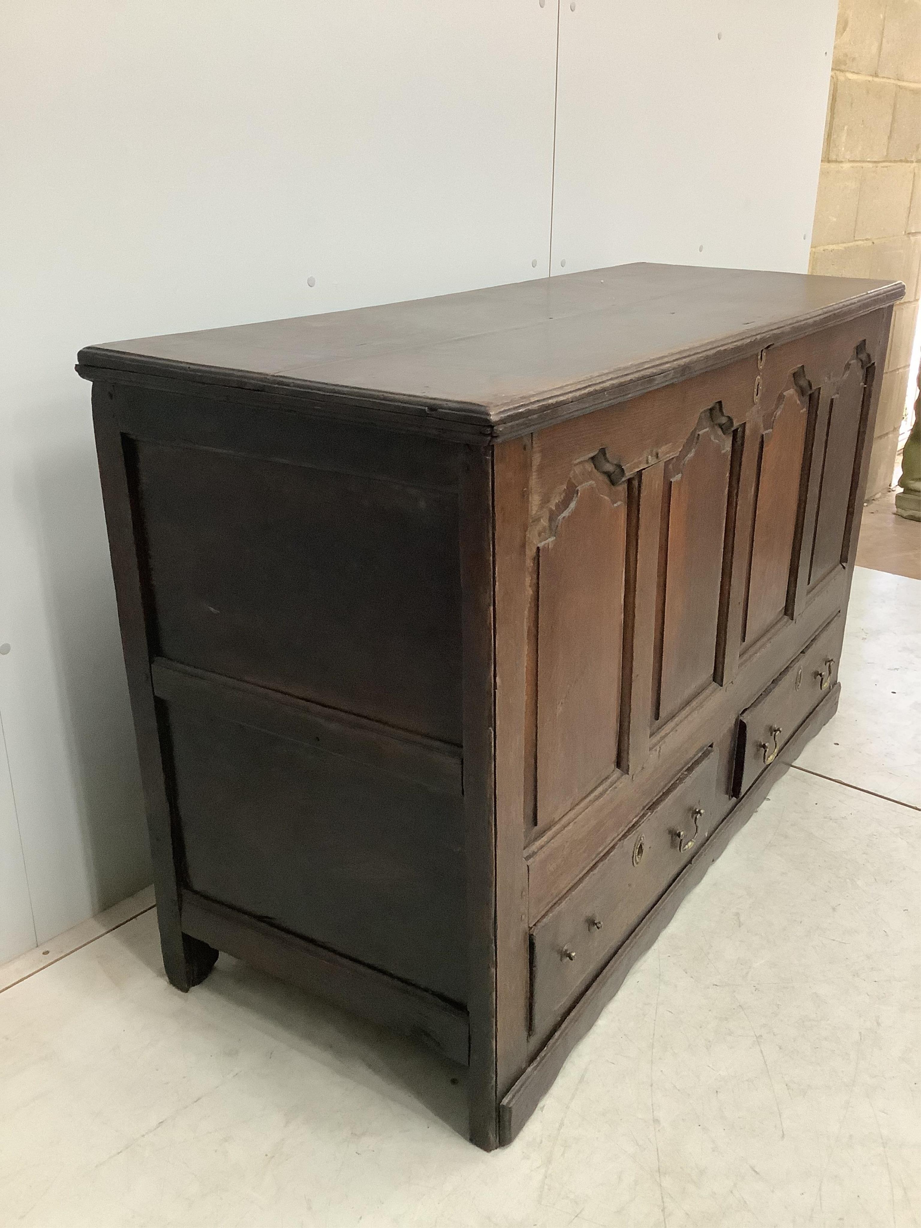 An 18th century oak mule chest, width 140cm, depth 53cm, height 88cm. Condition - fair